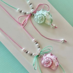 Dây chuyền vỏ ốc ánh xà cừ thắt nơ