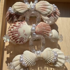 Kẹp càng cua vỏ sò và ngọc trai sang trọng